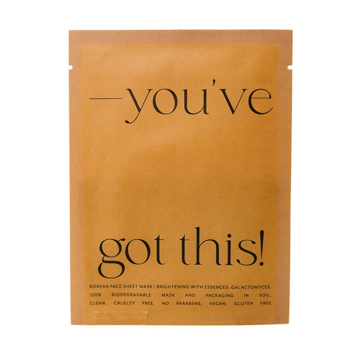 A single flat sheet mask packet in a warm caramel pouch with black text reading “—you’ve got this!” on a plain white background.