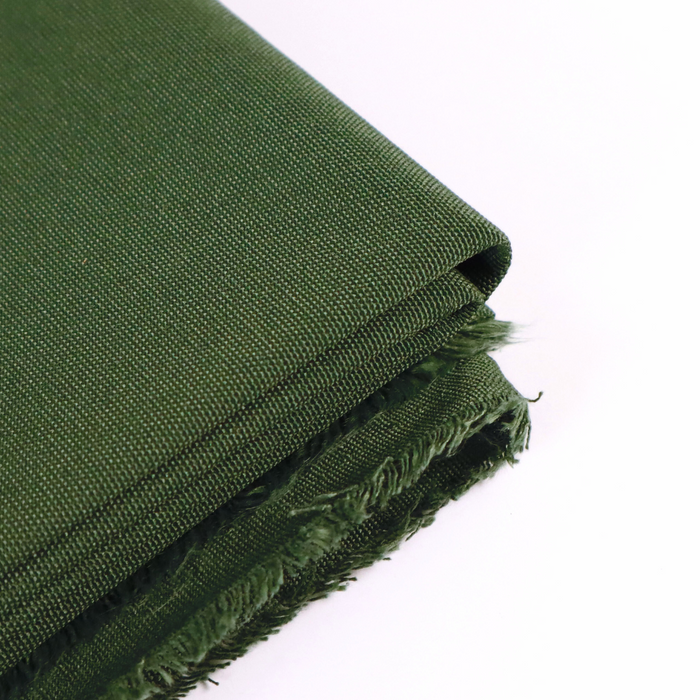 This ReNew Canvas solid is in a forest-y green shade. This photo is of the fabric folded.