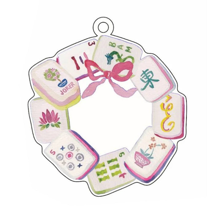 An acrylic ornament featuring illustrated mahjong tiles arranged as a wreath with a hanging loop at the top, shown on a plain white background.