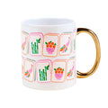 Mug with colorful Mahjong tile illustrations and a gold handle, on a white background.