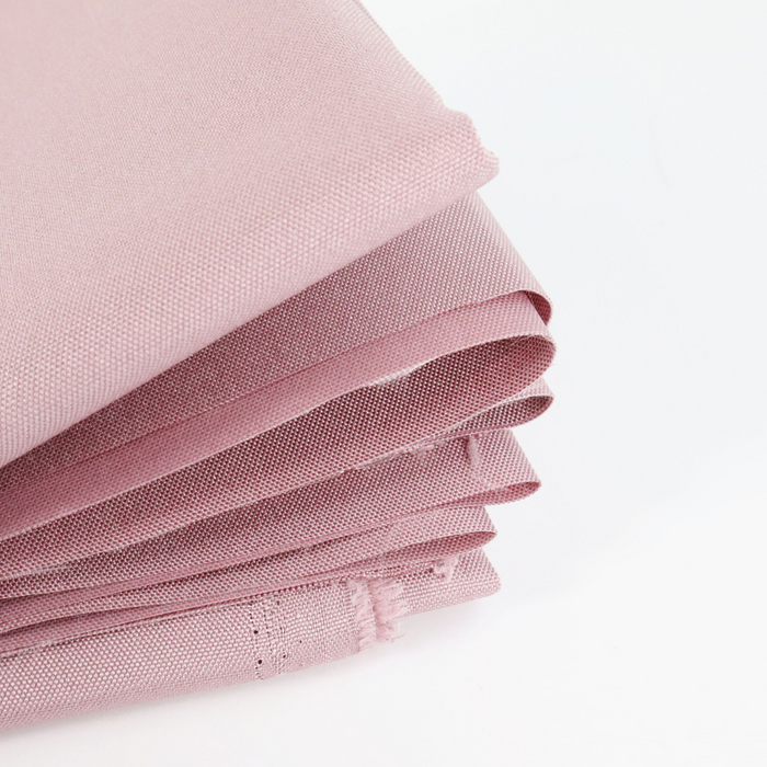 This WPC-Lite solid is a pale purple with pink undertones. This photo shows the fabric folded.