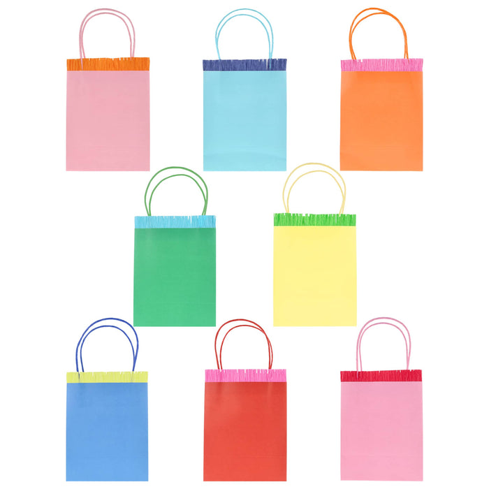 8 colorful paper favor bags with handles and fringe detail on a white background.
