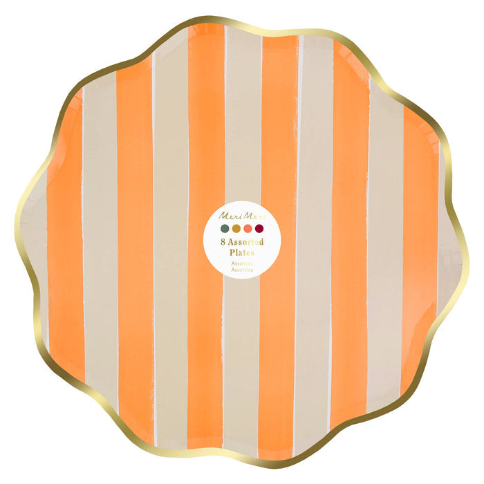 A paper plate with a scalloped edge, featuring vertical orange and cream stripes with a metallic gold border. A white circular label in the center reads 'Meri Meri 8 Assorted Plates'.