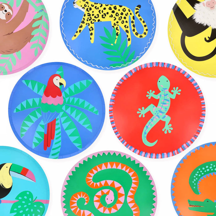 Colorful large paper party dinner plates with tropical animal illustrations, on a white background.