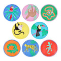 Set of 8 colorful small paper party plates with tropical animal illustrations, on a white background.