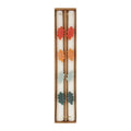A boxed set of two cream-colored candles with decorative wax autumn leaves in red, orange, yellow, mint, and green, presented in a brown cardboard package on a white background.