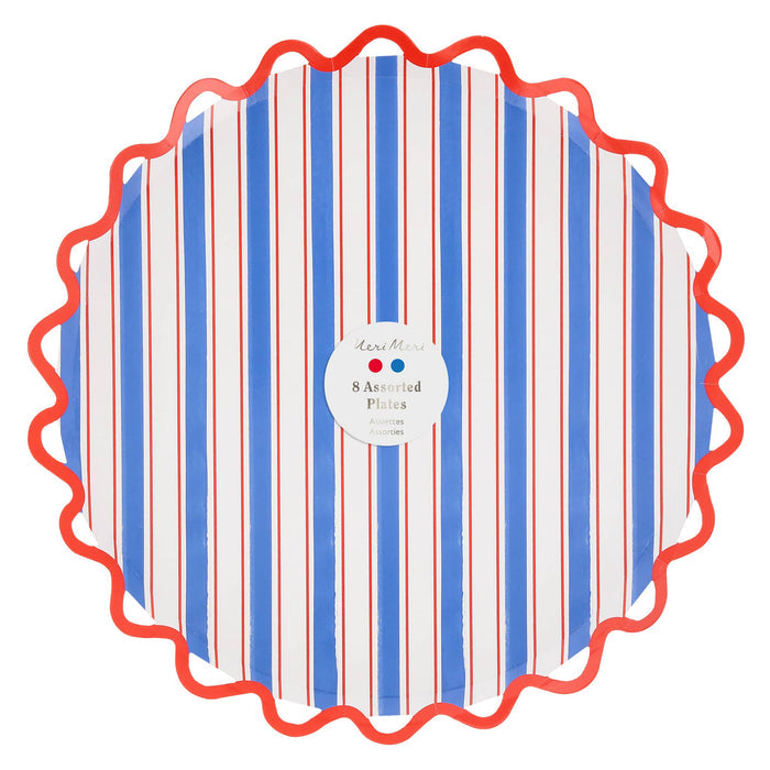 Large red, white, and blue striped paper plates with wavy edges, in packaging, on a white background.