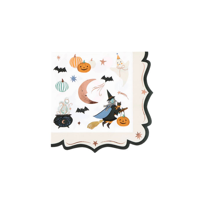 A square Halloween-themed small paper napkin with ornate edges, featuring illustrations of a witch on a broomstick, pumpkins, bats, a cauldron, a crescent moon, and stars on an off-white background.