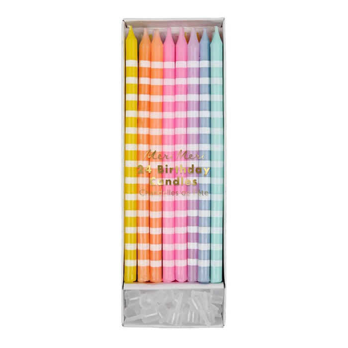 Box of colorful pastel birthday candles with a striped pattern on a white background.