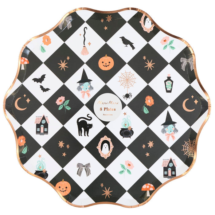 A scalloped round paper plate with a black and white checkered pattern decorated with various cute Halloween illustrations, including pumpkins, witches, ghosts, spiders, and mushrooms, finished with a metallic rose gold rim. Shown in packaging on a plain white background.