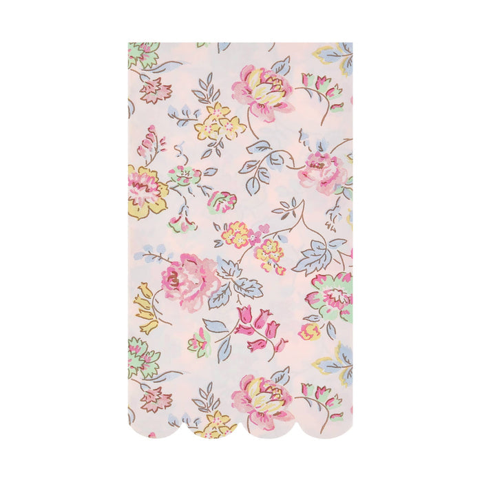Pink decorative paper guest towels with delicate pastel floral print and scalloped bottom edge, on a white background.