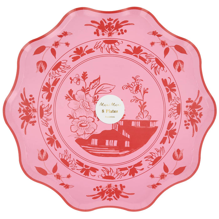 Large pink decorative plate with red floral patterns and wavy red edge, in packaging with a "Meri Meri" branded label, on a white background.