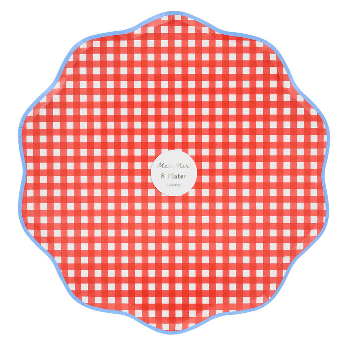 Large red and white gingham plates with wavy blue edge in packaging with a "meri meri" brand label, on a white background.