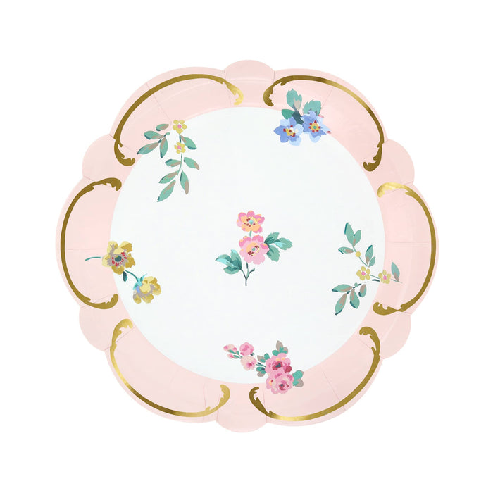 Decorative paper plate with floral design, pink border and gold details, on a white background.