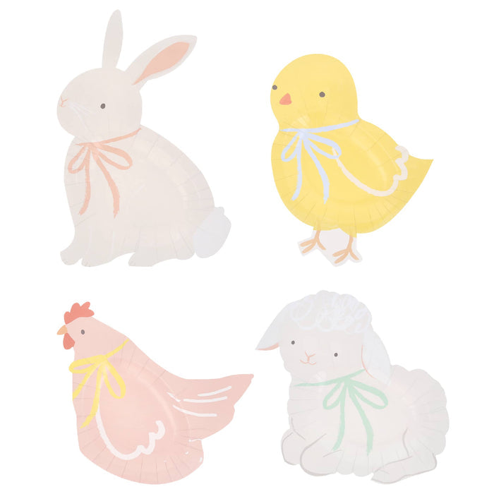 Set of four pastel-colored Easter-themed shaped plates on a white background.