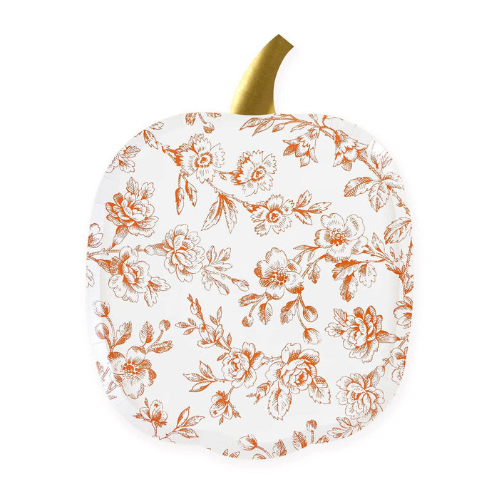 A decorative pumpkin-shaped paper plate with a white background and an orange floral toile pattern, featuring a metallic gold stem at the top, shown on a white background.