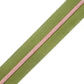 Muted shade of green zipper tape with rose gold coil teeth.