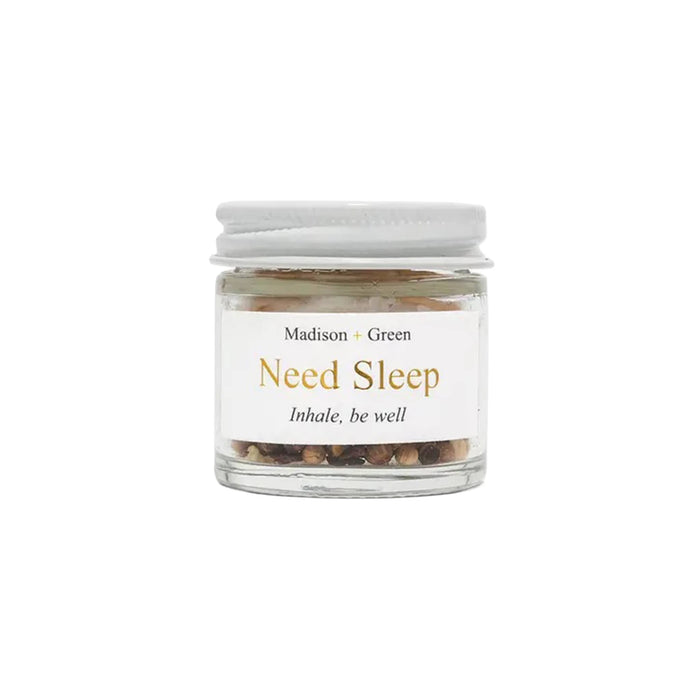 Need Sleep aromatherapy inhaler in a glass jar, front view, on a white background.