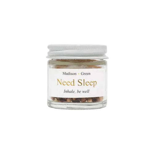 Need Sleep aromatherapy inhaler in a glass jar, front view, on a white background.