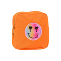 Neon orange square zip pouch with a tie-dye smiley face patch with palm tree eyes, on a white background.