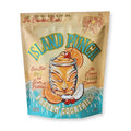 Front of pouch packaging of Island Punch Frozen Cocktail Mix with tiki mug illustration on a beige and blue backdrop, on a white background.