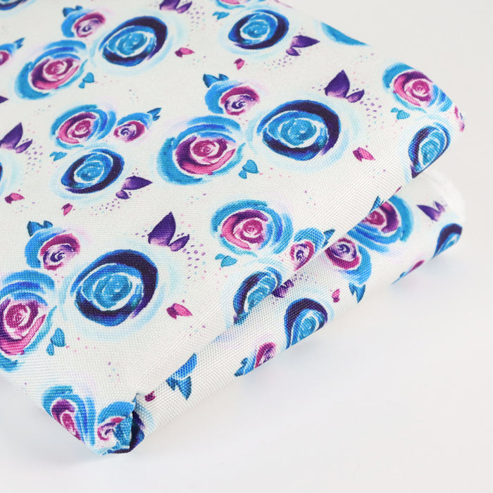 This printed WPC-Lite is of watercolor roses in purple, blue, and pink. This photo shows the fabric folded.