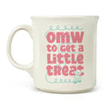 White mug with pink text that says "omw to get a little treat" and girl on scooter graphic on a white background.