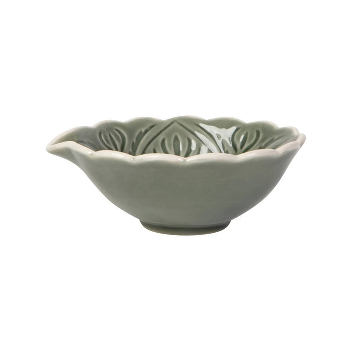 A small ceramic bowl with a scalloped rim and leaf-like embossed pattern inside, finished in a matte sage green glaze, side view, shown on a plain white background.