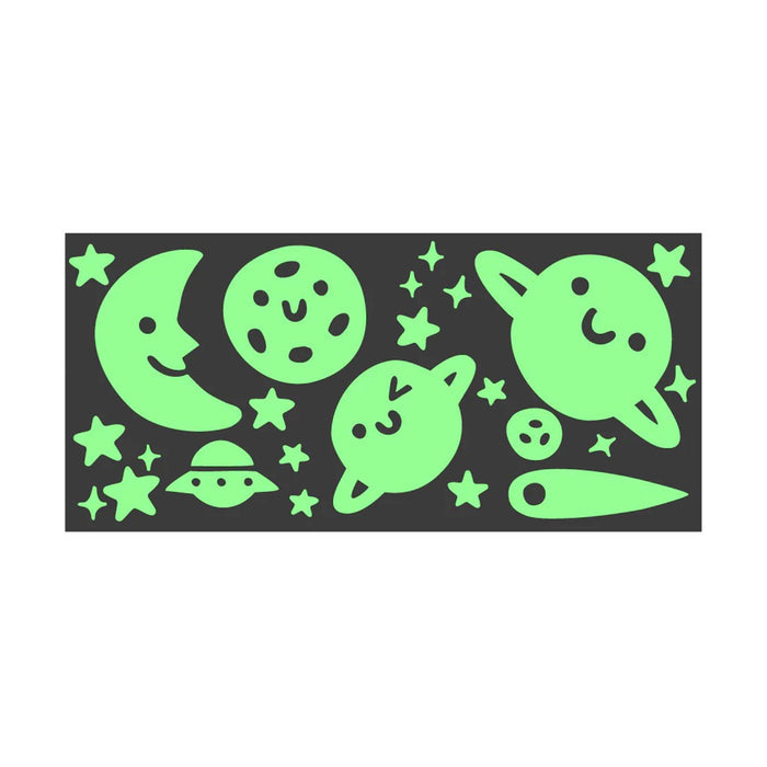 Glowing green space-themed stickers on a black sticker sheet, on a white background.
