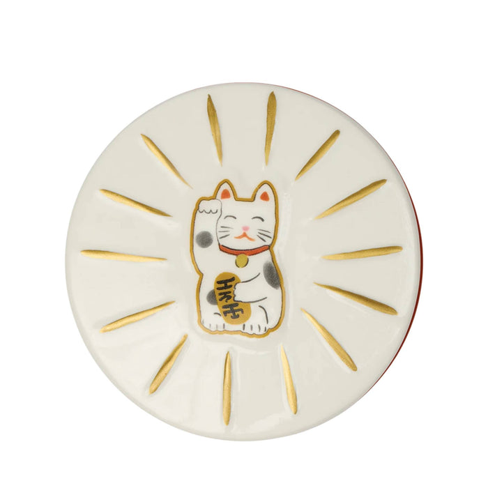 A round white ceramic plate featuring a hand-painted lucky cat (Maneki-neko) in the center, surrounded by gold rays on a white background.