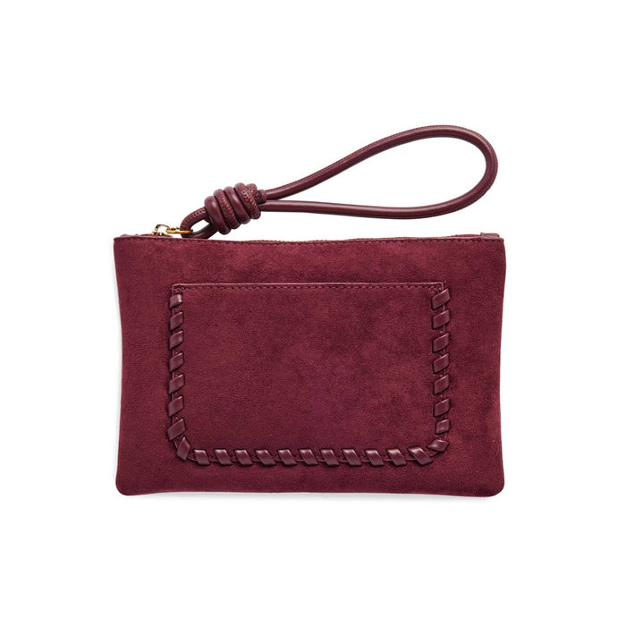 A dark red vegan suede pouch wallet with a front whipstitched pocket and a knotted leather wristlet strap, front view shown on a plain white background.