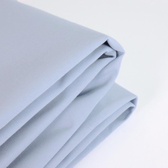 This ReNew Solid is in a light pastel shade of baby blue. This photo is of the fabric folded.