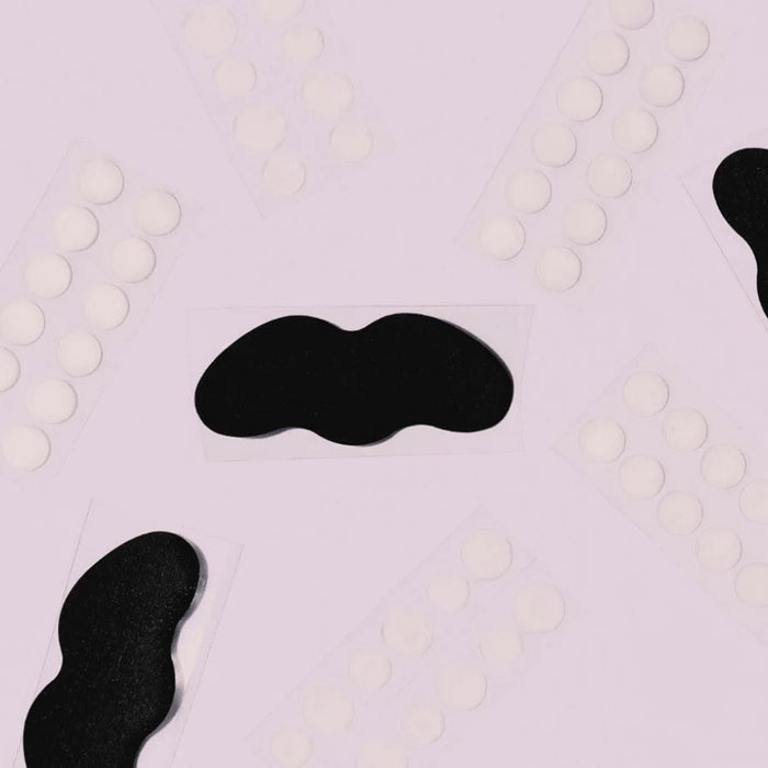Patchology Breakout Box 3-in-1 Acne Treatment Kit contents on a purple background.