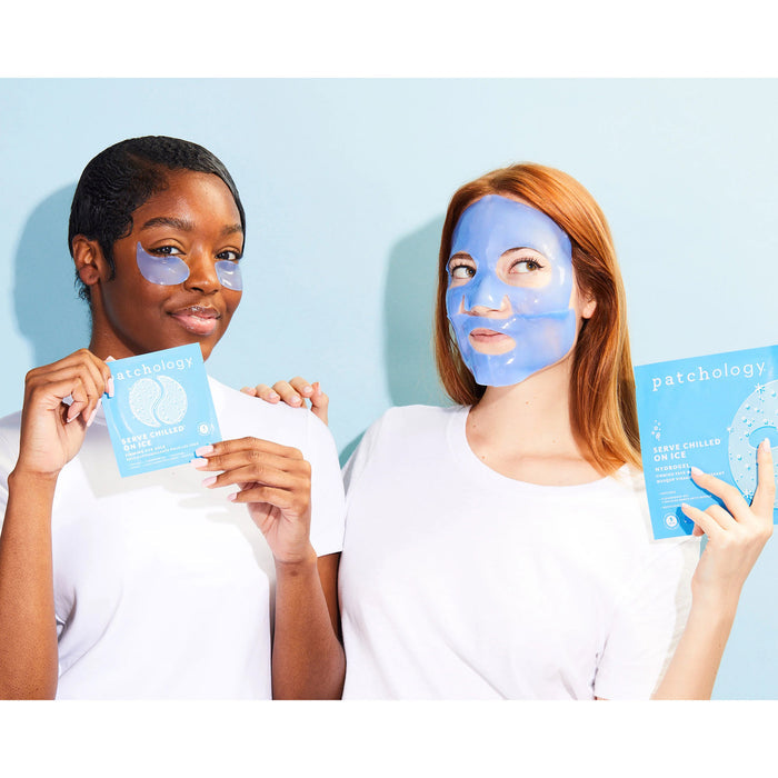 2 women wearing Patchology Serve Chilled on Ice, one is wearing the eye gels and holding the packaging, the other is wearing the face mask and holding the packaging.