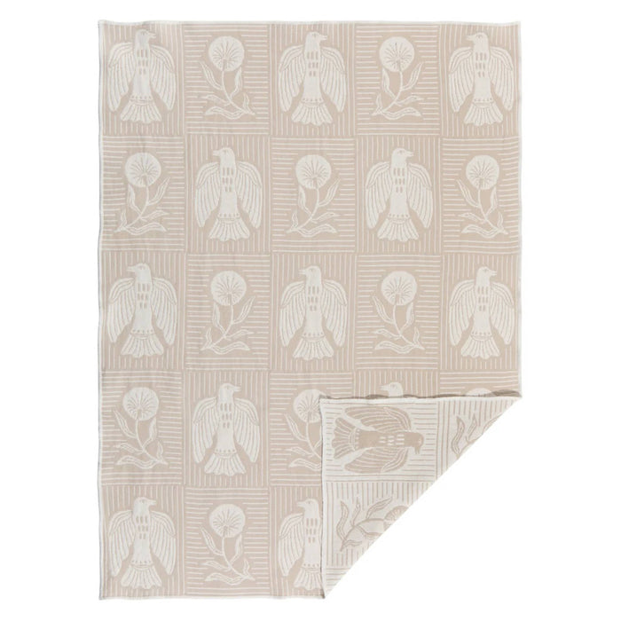 Double-sided beige dishtowel with white bird and floral pattern on a white background.