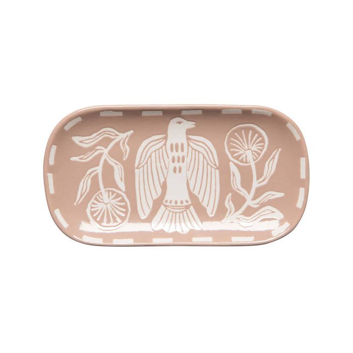 Rectangular ceramic tray in dusty pink with Peregrine design in white, on a white background.