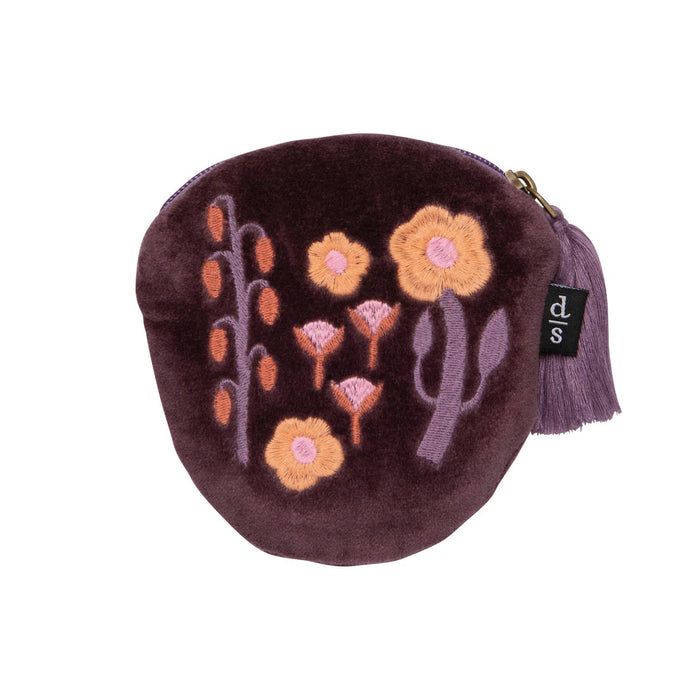 Dark purple velvet coin purse with floral embroidery and purple tassel on a white background.