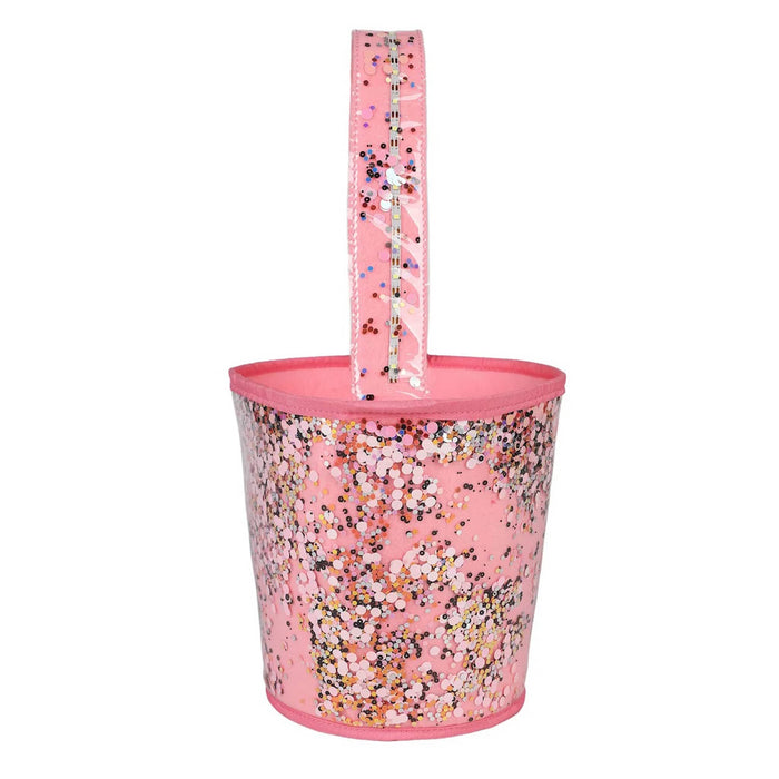 Side view of a pink bucket bag with a clear sleeve with multicolor sequins, featuring a pink fabric handle and trim, shown against a plain white background.