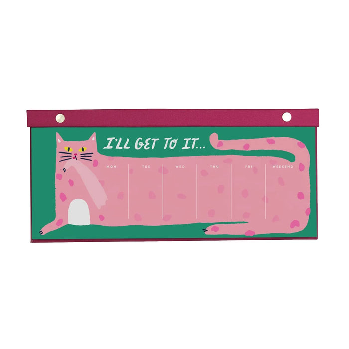 A weekly planner desk calendar featuring a pink cat illustration on a green background with the text 'I'LL GET TO IT.'