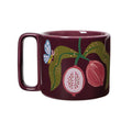 A dark burgundy ceramic mug featuring a hand-painted botanical illustration of a butterfly, green leaves, and fruit on the side, set against a plain white background.