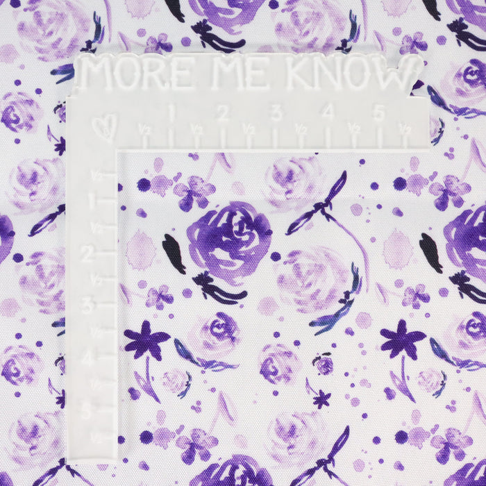 This printed WPC-Lite is of watercolor flowers in purple tones. This photo shows a white L shaped ruler for scale.