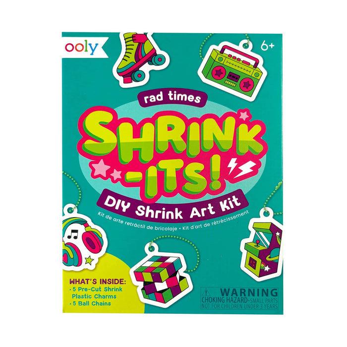 Ooly Rad Times Shrink-Its! DIY Mini Shrink Art Kit box, featuring a bright teal green cover with colorful cartoon illustrations of roller skates, a boombox, headphones, a Rubik's cube, and an arcade game, along with age 6+ and warning text.