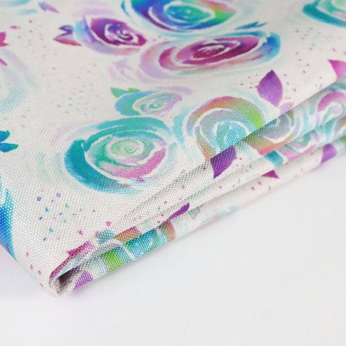 This printed WPC-Lite is of watercolor roses in a rainbow ombre. This photo shows the fabric folded.