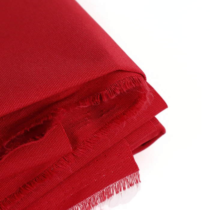 This ReNew Solid is in a standard shade of red. This photo is of the fabric folded.