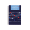 Red, white, and blue LED wire string lights in box packaging, on a white background.