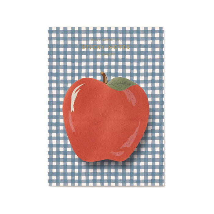 Red apple-shaped sticky notes pad on blue and white gingham card packaging, on a white background.