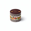 A round metal tin candle labeled 'CLEMENTINE AND CLOVE' by Rifle Paper Co., featuring a dark brown lid and a cream-colored band decorated with illustrations of citrus fruits and autumn leaves.