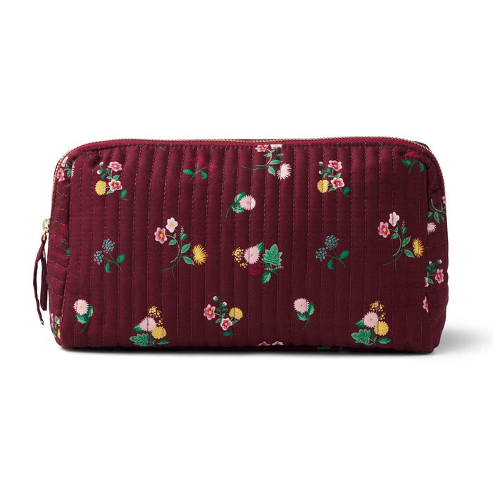 A quilted burgundy cosmetic pouch with a small-scale floral print in pink, yellow, green, and white, front view shown on a plain white background.