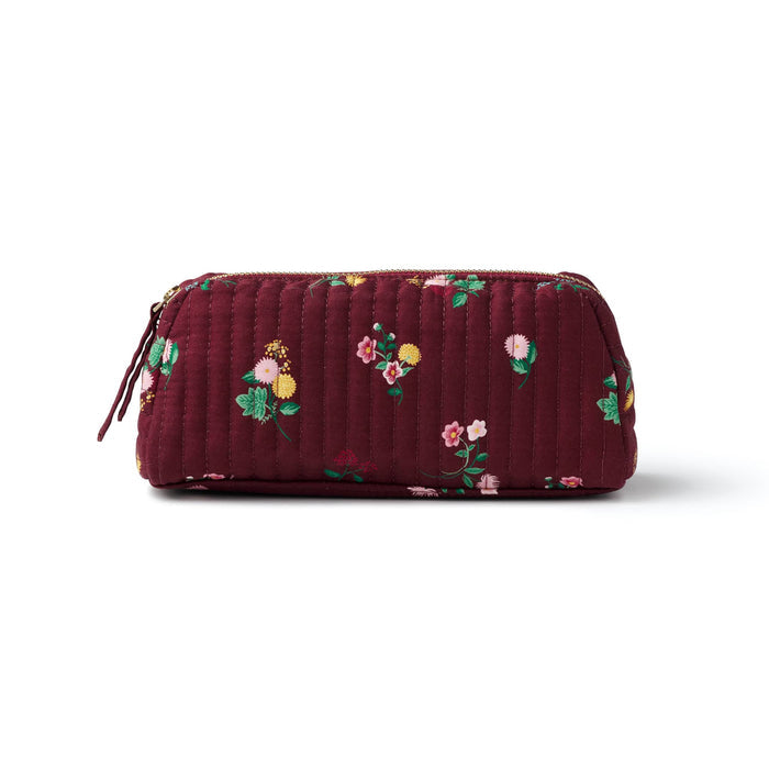 A small quilted burgundy cosmetic pouch with a small-scale floral print in pink, yellow, green, and white, front view shown on a plain white background.