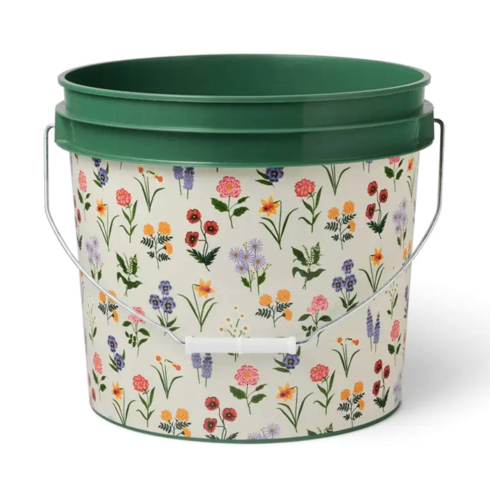 Green bucket with floral pattern on a white background.